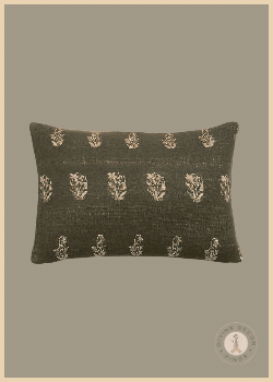 Crate & Barrel Ivy burnt green lumbar pillow cover with repeating ivory botanical motifs woven into the fabric.