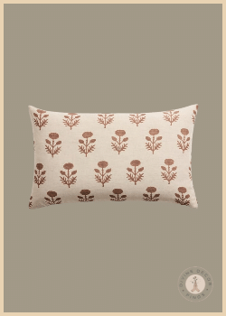 Quince reversible lumbar pillow cover in ivory with a repeating rust floral block print, featured on a neutral background.