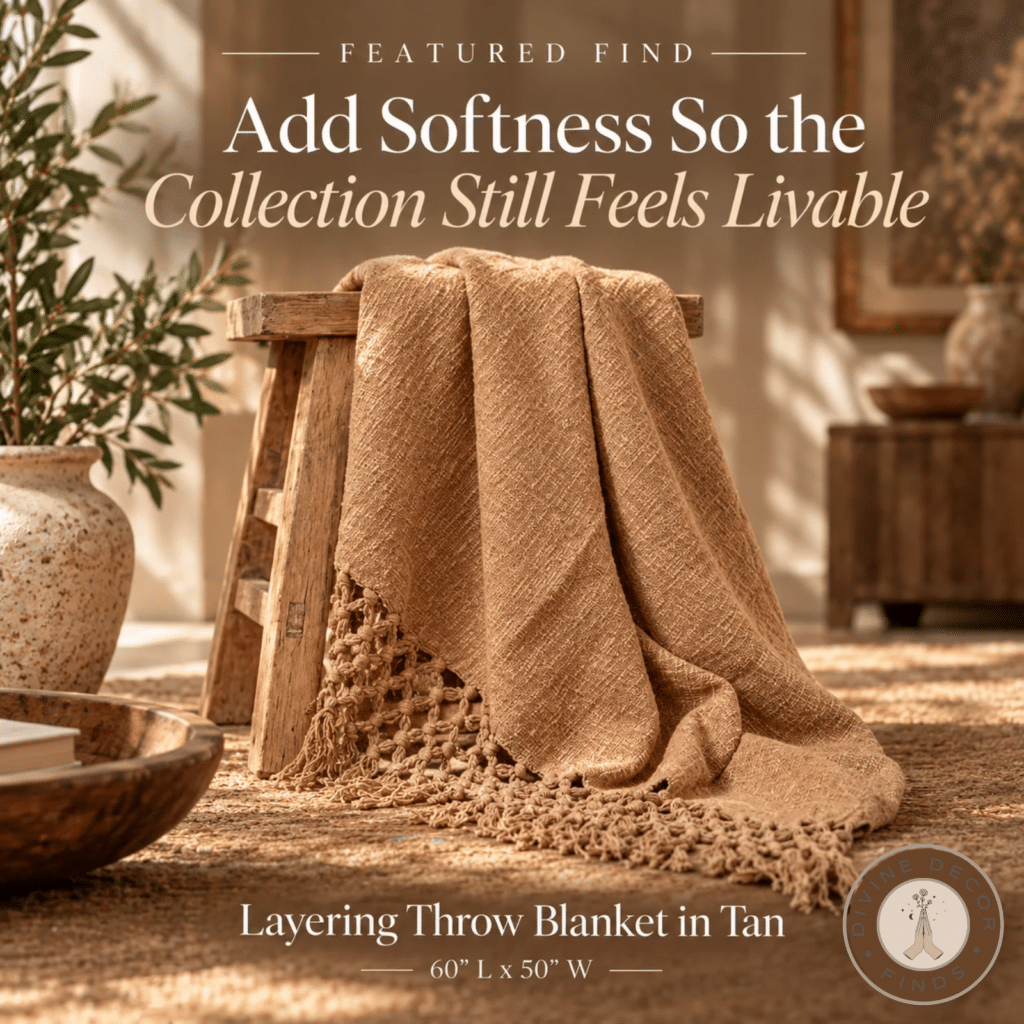 Tan woven throw blanket with crocheted fringe draped over a rustic wood stool in a warm neutral Organic Modern interior.