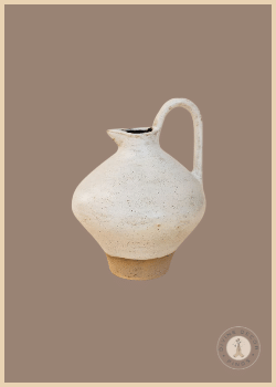 Cream Cancale Pitcher from Shoppe at The Avenue with an irregular sculptural shape and softly textured ceramic finish.