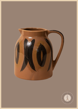 Brown CeCe Pitcher from Shoppe at The Avenue featuring bold black hand-painted abstract markings and a curved handle.
