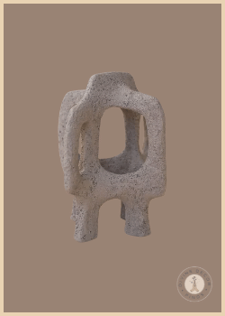 Ilima Sculpture from Shoppe at The Avenue with a coarse gray-brown resin texture and abstract geometric open form.