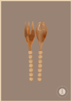 Jacki Servers from Shoppe at The Avenue made from natural buffalo horn with translucent resin ball handles.