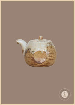 Small Mardy Handleless Pitcher from Shoppe at The Avenue with a brown and cream reactive glaze and rounded teapot form.